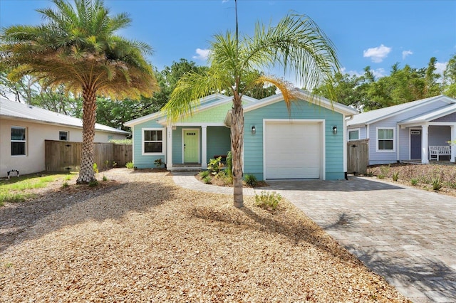 403 Second St, Saint Augustine, FL 32084 - single story home featuring a garage, fence, a porch, and decorative driveway