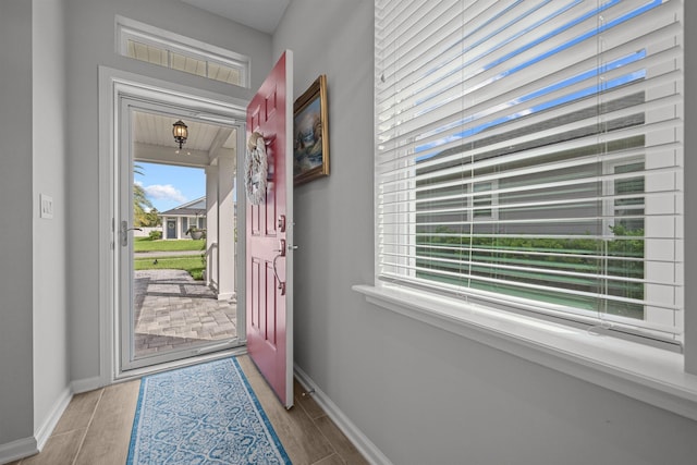 doorway with light hardwood / wood-style flooring