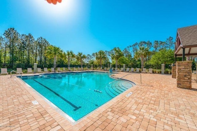 view of swimming pool featuring a patio area