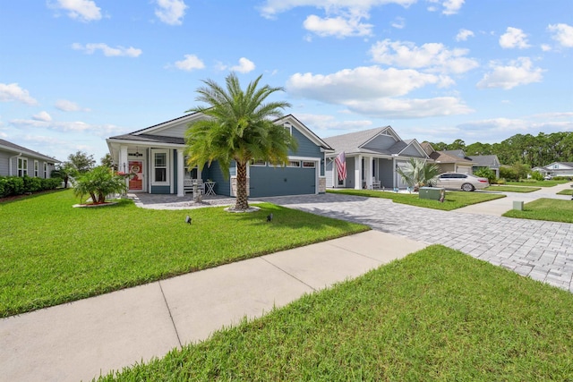 view of front of home featuring a garage and a front yard