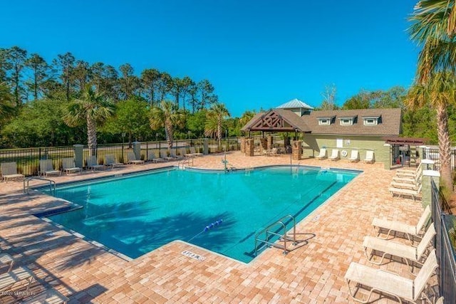 view of swimming pool with a patio area