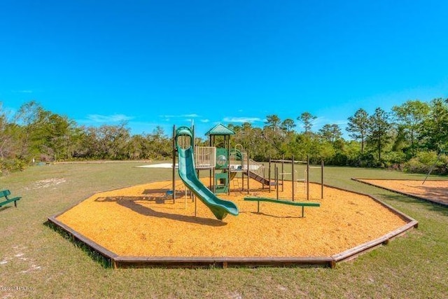 view of playground featuring a lawn