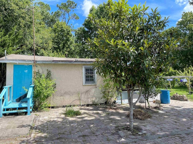 view of property exterior featuring a patio