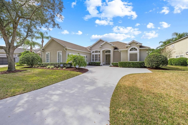 ranch-style house with a front lawn