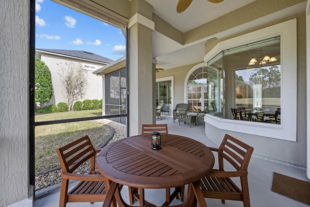 sunroom featuring ceiling fan