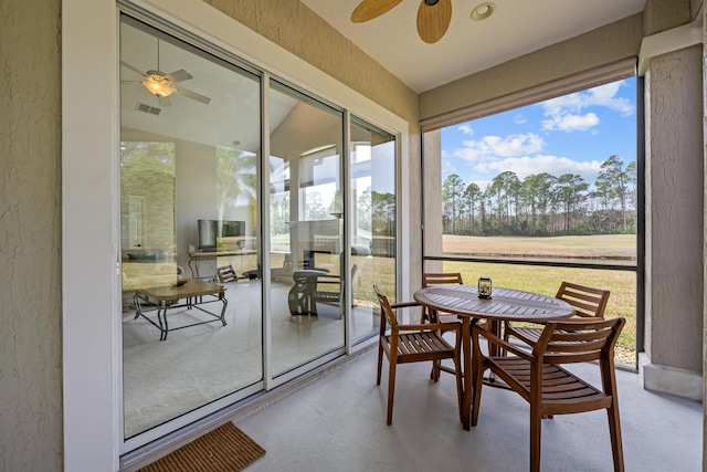 sunroom / solarium with ceiling fan