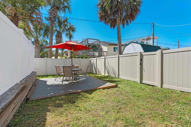 view of yard with a wooden deck