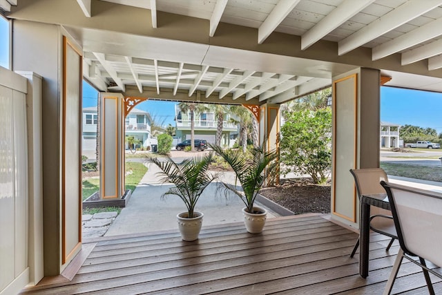 sunroom with beam ceiling