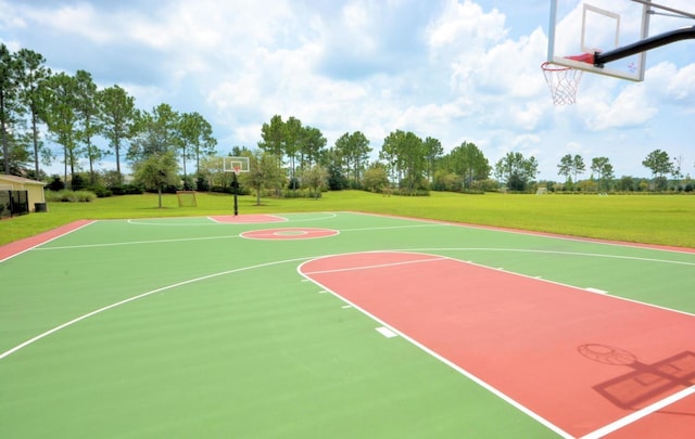 view of basketball court featuring a yard