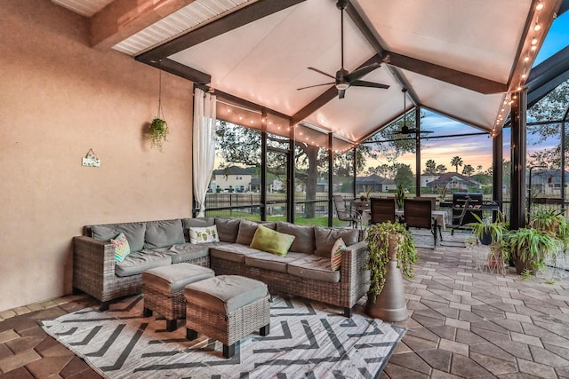 exterior space featuring vaulted ceiling with beams and ceiling fan