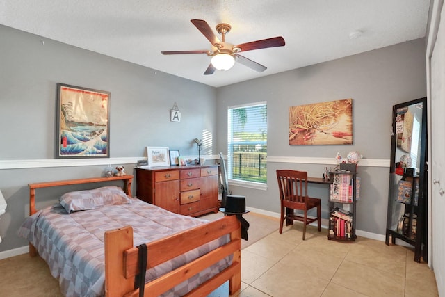 tiled bedroom with ceiling fan