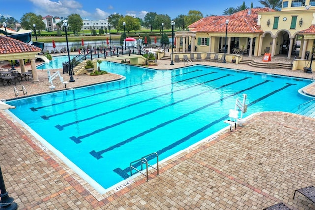 view of swimming pool with a patio