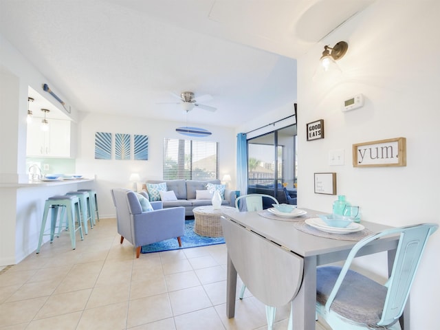 dining room with light tile patterned floors and a ceiling fan