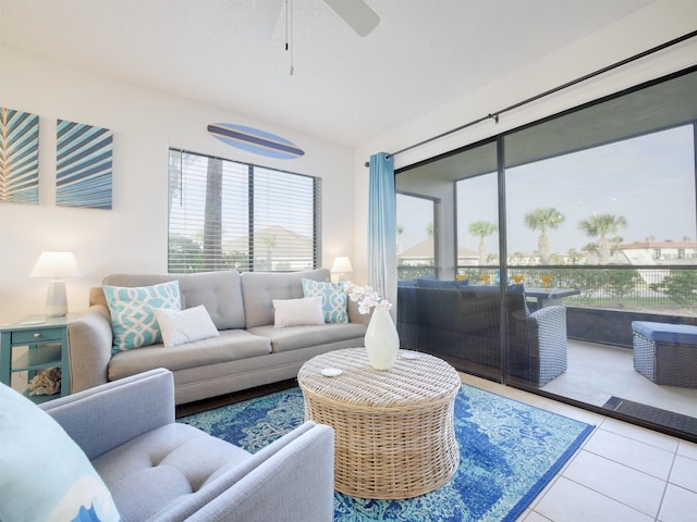 tiled living area featuring a textured ceiling and ceiling fan