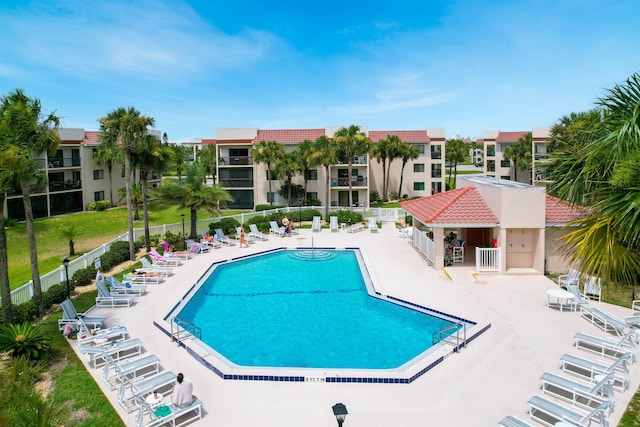 pool featuring a patio area and fence