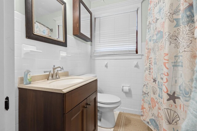 full bathroom featuring tile walls, toilet, vanity, and a shower with curtain