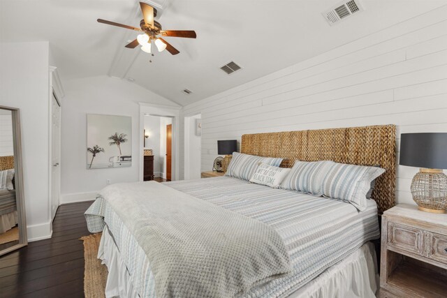 bedroom featuring visible vents, vaulted ceiling with beams, baseboards, and dark wood-style flooring