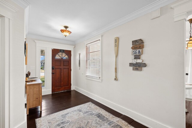 foyer with dark wood-style floors, baseboards, and ornamental molding