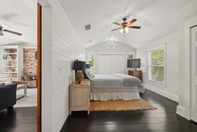 bedroom with dark wood finished floors, visible vents, a ceiling fan, and vaulted ceiling