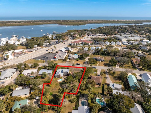 aerial view with a residential view and a water view