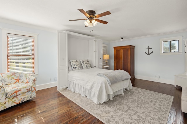 bedroom featuring multiple windows, ornamental molding, and dark wood-style flooring