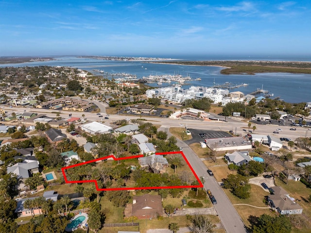 birds eye view of property featuring a water view