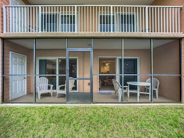 4 Ocean Trace Rd Unit 123, Saint Augustine, FL 32080 - rear view of property with a balcony, stucco siding, and a sunroom