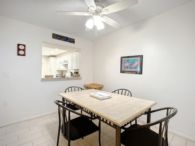 4 Ocean Trace Rd Unit 123, Saint Augustine, FL 32080 - dining room with a textured ceiling and a ceiling fan