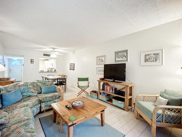 4 Ocean Trace Rd Unit 123, Saint Augustine, FL 32080 - living area featuring a textured ceiling and ceiling fan