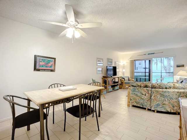 4 Ocean Trace Rd Unit 123, Saint Augustine, FL 32080 - dining space featuring a textured ceiling and a ceiling fan