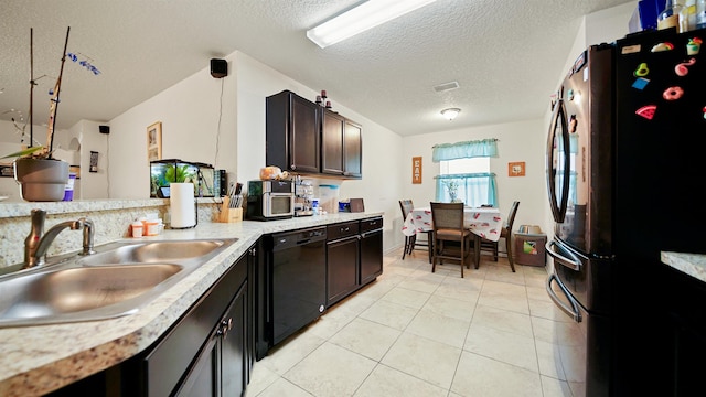 kitchen with refrigerator, dark brown cabinets, sink, pendant lighting, and dishwasher