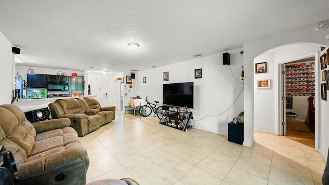 living room with a textured ceiling