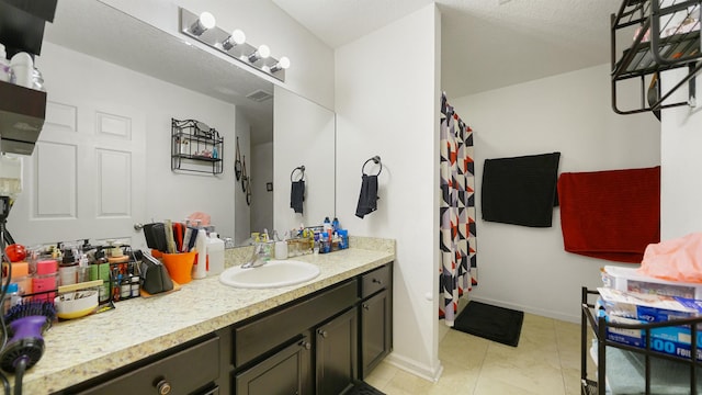 bathroom featuring vanity and tile patterned floors