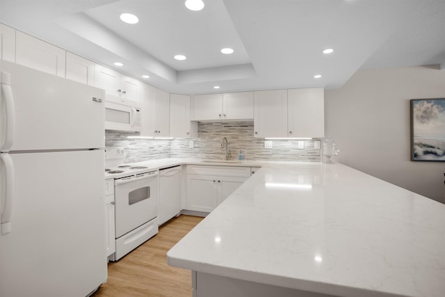 7990 A1A S, Saint Augustine, FL 32080 - kitchen featuring white appliances, a sink, light stone counters, light wood finished floors, and recessed lighting