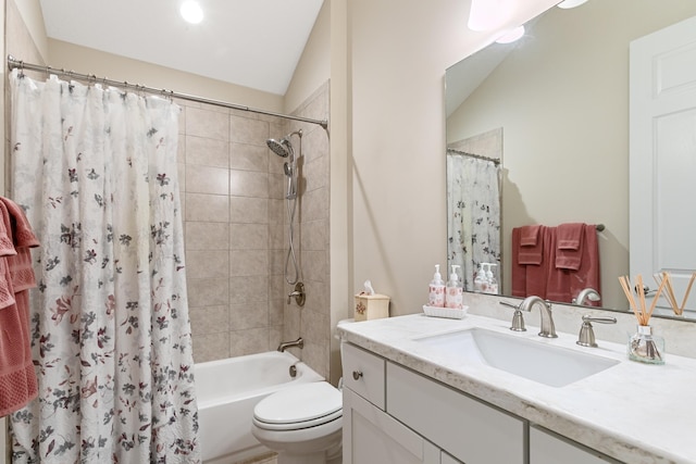 full bathroom with vanity, shower / bath combination with curtain, toilet, and vaulted ceiling