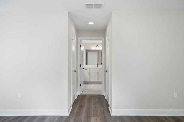 hall with dark hardwood / wood-style floors