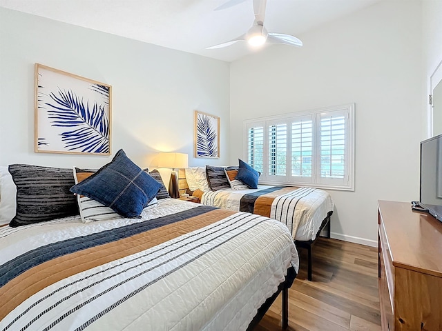 bedroom featuring ceiling fan and hardwood / wood-style floors