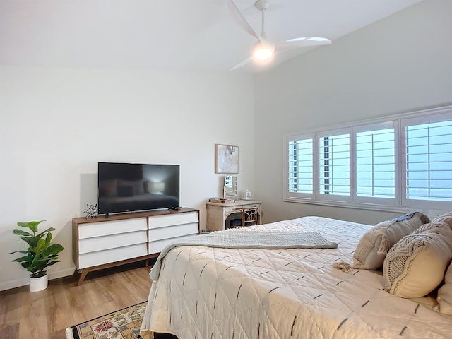 bedroom with ceiling fan and wood-type flooring