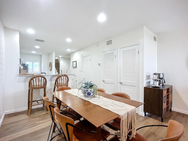 dining room with light hardwood / wood-style floors