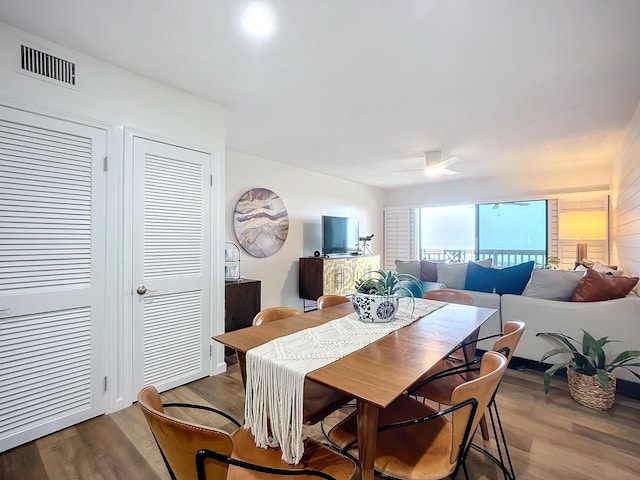 dining room featuring ceiling fan and hardwood / wood-style flooring