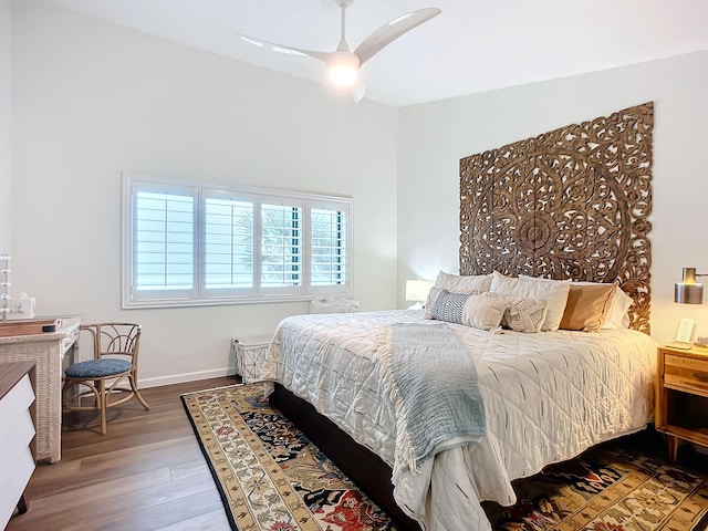 bedroom with ceiling fan and hardwood / wood-style flooring