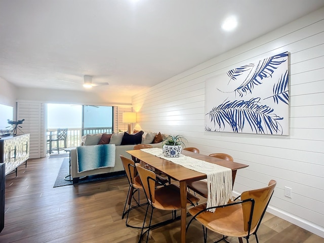 dining space featuring dark hardwood / wood-style flooring and ceiling fan