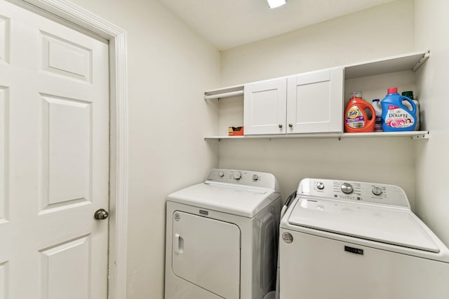 laundry area with cabinet space and washing machine and dryer