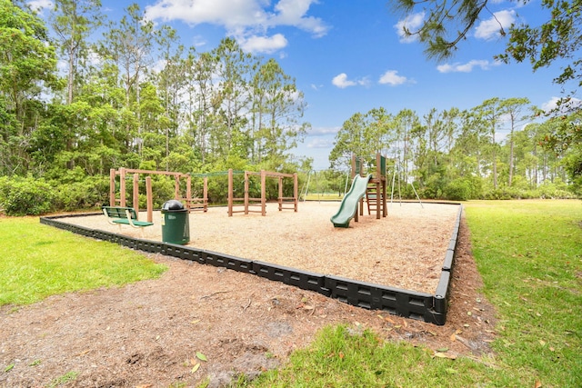community jungle gym featuring a lawn