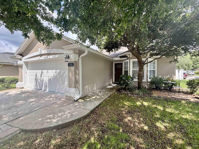 view of home's exterior featuring stucco siding and an attached garage