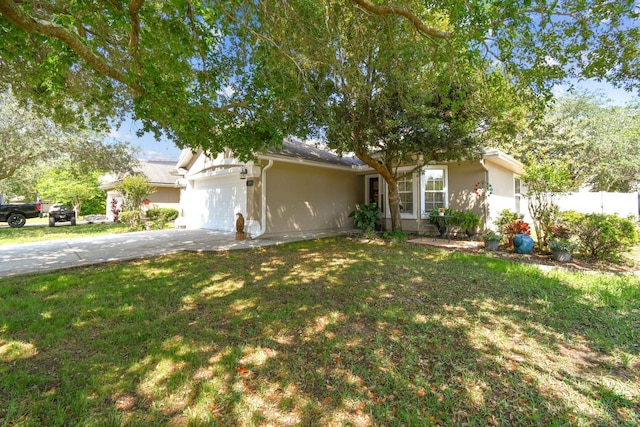 view of front of home featuring driveway, a garage, and stucco siding
