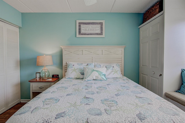 bedroom featuring dark wood-type flooring