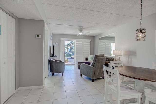 living room with ceiling fan and light tile patterned flooring