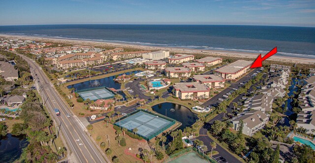 drone / aerial view with a water view and a view of the beach