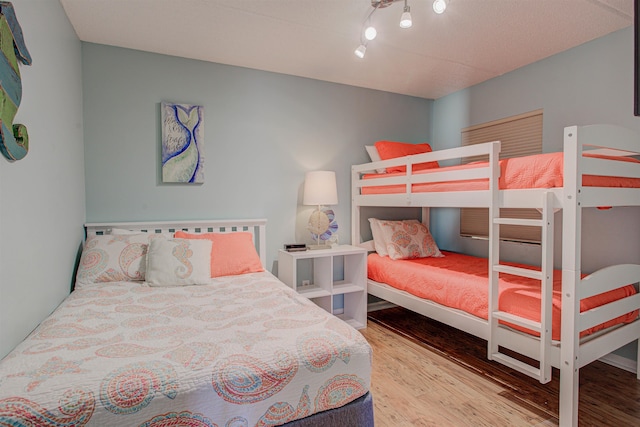 bedroom with hardwood / wood-style flooring